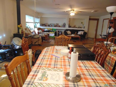 Tiled dining area featuring a ceiling fan