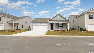 View of front of property with a garage and centra