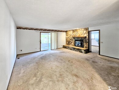 Sliding door to the backyard and covered patio