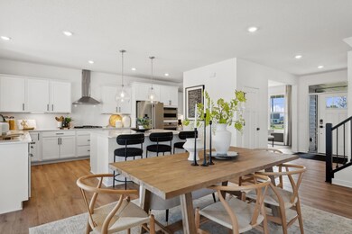 (Photo of model home, finishes will vary) The breakfast room provides a convenient spot for casual meals and friendly conversations between the kitchen and family room
