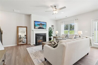 Living room with plenty of natural light, hardwood