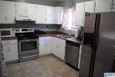 Freshly painted cabinets, new hardware, fresh pain