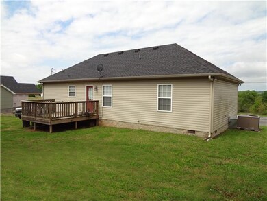 The back yard offers plenty of space for the kids to play and allows you to have more time enjoying your home than cutting the grass. 
