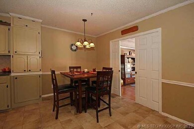 Dining area just off kitchen. Pocket doors lead to
