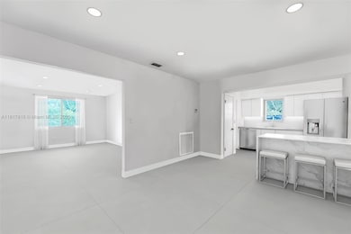 Virtually updated living room, kitchen and dining room