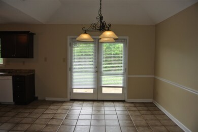 Breakfast area with tile floors with French doors.