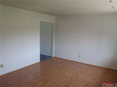 Living Room leads to the eat-in kitchen.