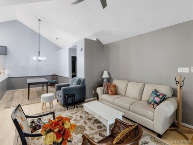 Vaulted ceiling, open to kitchen & dining area.