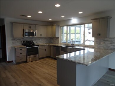 Granite countertops, tile backsplash, farm sink, r