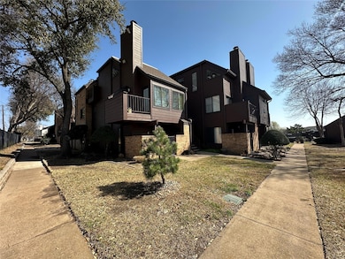 View of side of home featuring brick siding and a 
