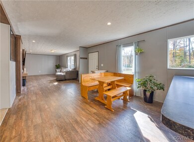 Dining room with a textured ceiling, a healthy amo