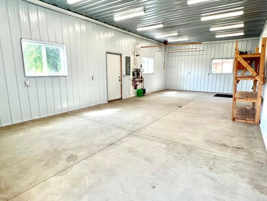 The heated portion measures 18x40 with in-floor heat, spray foam insulation, finished walls and ceilings and even offers a floor drain!