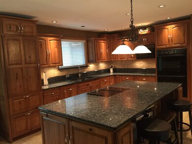 Look at the Granite counter-top and back splashes.