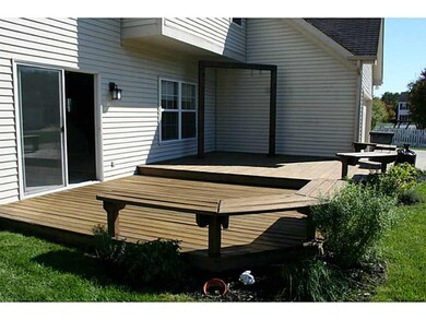 Deck. 2 tier wood deck has stand built in for hammock/swing and herb garden nearby.l