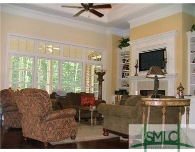 Living Room. Builtins, trey ceiling with cove ligh