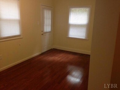 Dining room with laminate flooring.