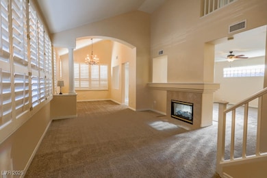 Unfurnished living room featuring visible vents, c