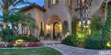 Cantera iron and leaded glass entry door leads to 