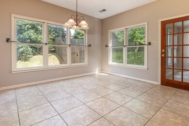 Bright, extra large breakfast area looks out into 