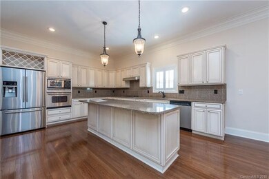 Gourmet Kitchen with wood floors,heavy moldings, r