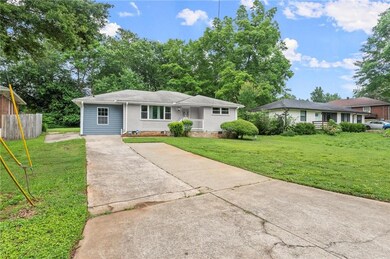 View of front of house with concrete driveway