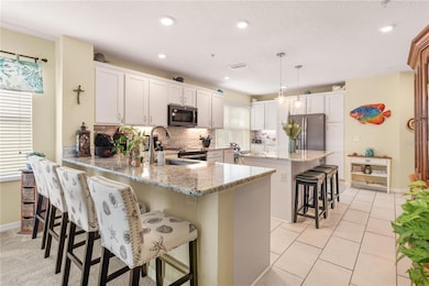 Light and bright kitchen with large center island.