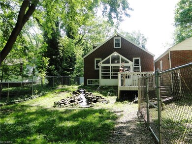 Back view of property showing fish pond,sun room, 