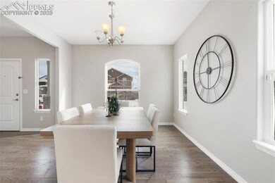 Dining space featuring a notable chandelier and da
