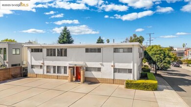 Back of house with stucco siding and brick siding