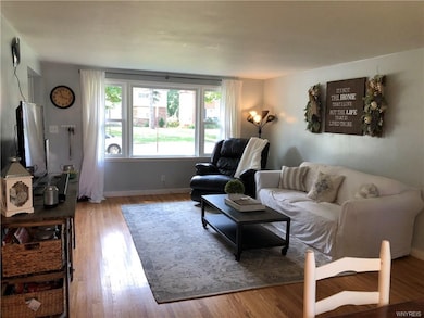 Large, bright living room/dining room.  Note refin