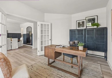 Office space with french doors and wood finished floors