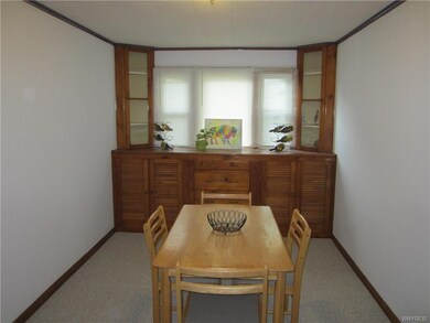 Berber carpeted Dining Room w/built-in cabinets