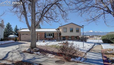 Split level home featuring a mountain view and a g