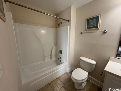 Full bathroom with tile patterned flooring, vanity