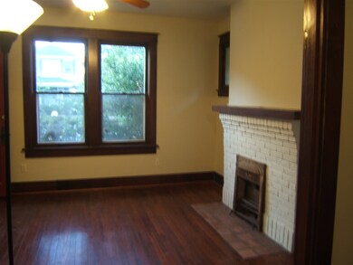 A shot of the living room showing the fireplace.