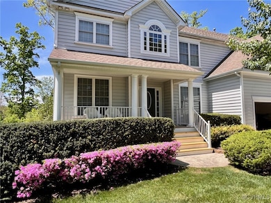 View of front of house with covered porch and roof