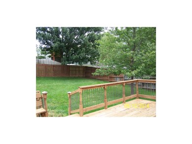 Slightly sloped yard with large deck