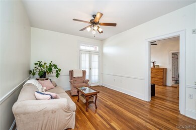 Enter into the cozy Living Room with ceiling fan a