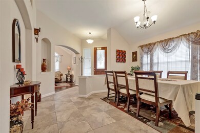 The formal dining area features tiled flooring and