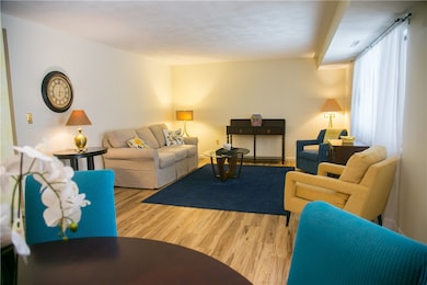 Looking into the living room from the dining area demonstrates just how much living space is in this oversized one bedroom unit.