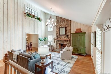 Neutral 2 story great room with beautiful hardwood