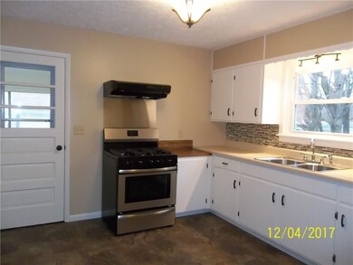 Kitchen and entrance from sunroom/porch