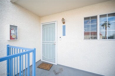 Doorway to property with stucco siding