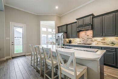 The kitchen is light, bright, and open to the living space with ample counter and cabinet space.