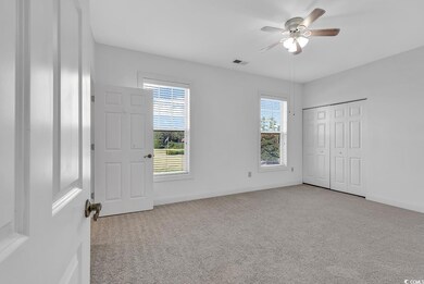 Unfurnished bedroom with ceiling fan, light colore