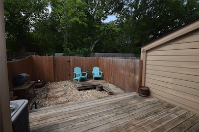 Deck with a fenced backyard