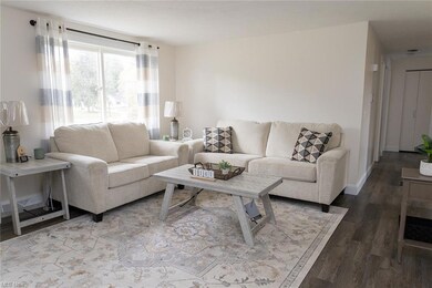 View of hardwood floored living room