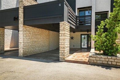 Entrance to property featuring stucco siding, fre