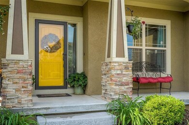Covered front porch.  Nicely landscaped.