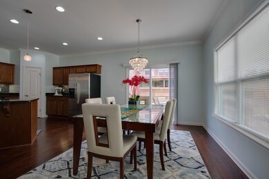 Great area for a dining room looking out to back patio.  Double window added for more light in the home!